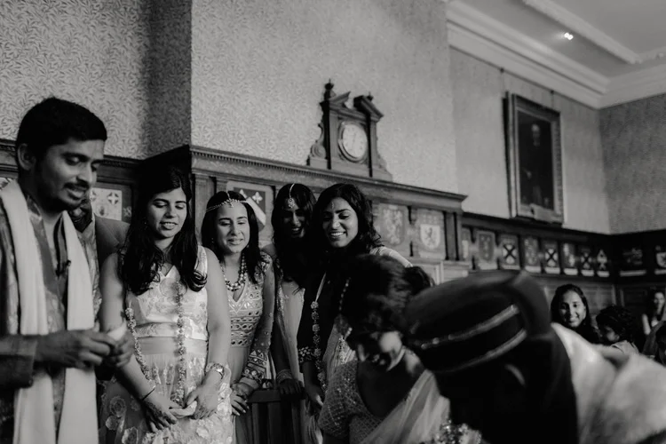 bridesmaid look on during hindu ceremony at the great hall