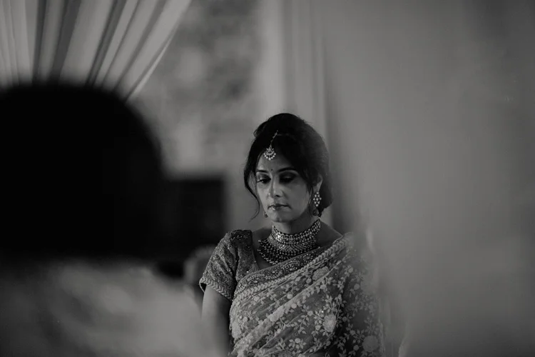 brides mother looks on during hindu ceremony at the great hall