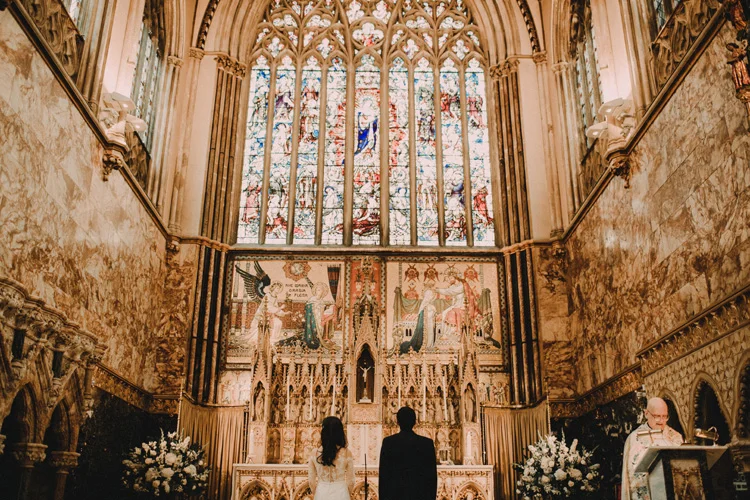 bride and groom at altar during farm street church wedding