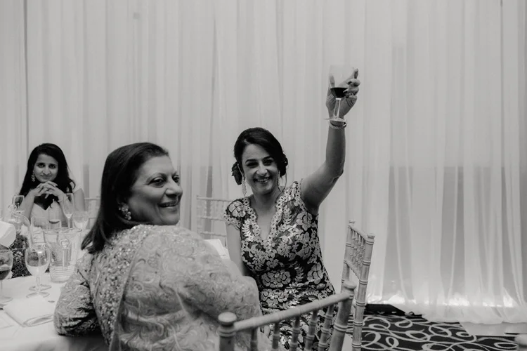 brides mother raises glass after speech during southampton wedding reception