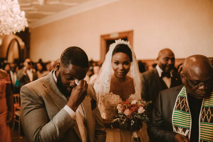 groom sheds a tear during froyle park wedding