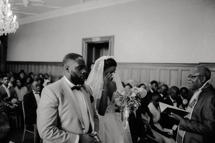 bride sheds a tear during ceremony at froyle park