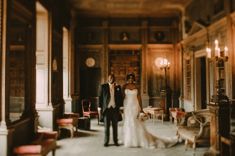bride and groom hold hands during syon park wedding