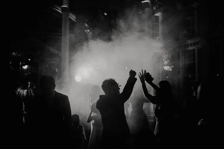 wedding guests dance during wedding reception at syon park