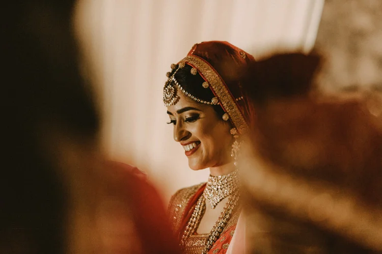 bride smiles during hindu wedding ceremony at the great hall