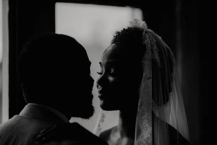 bride and groom lean in for kiss after ceremony at froyle park 