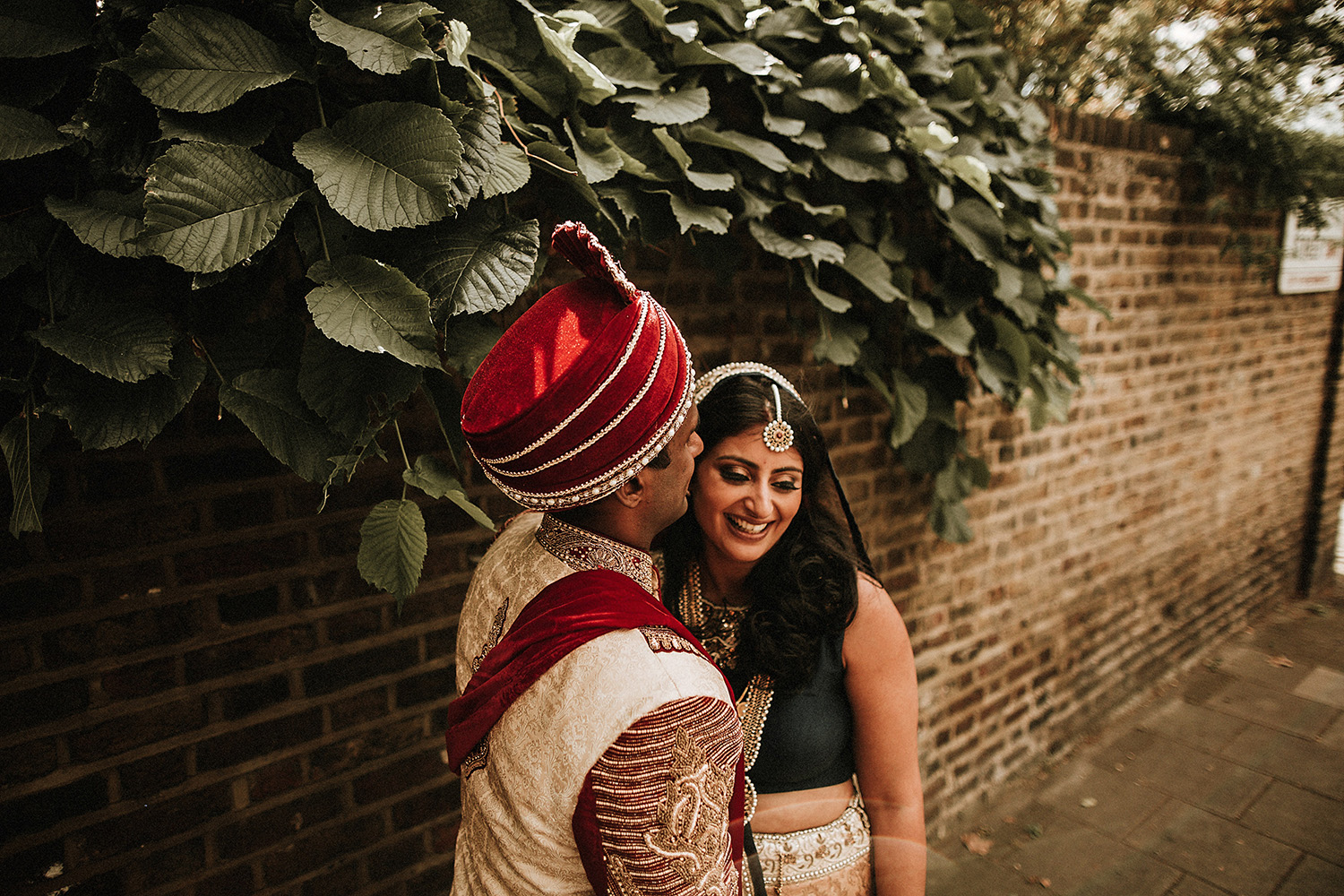 indian couple share a laugh during hindu wedding