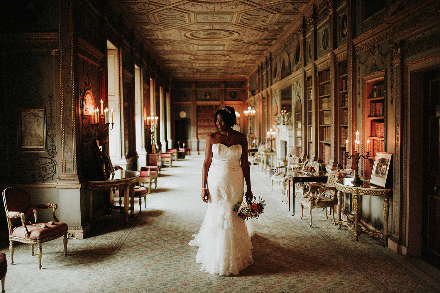 bride looks out window in syon park wedding