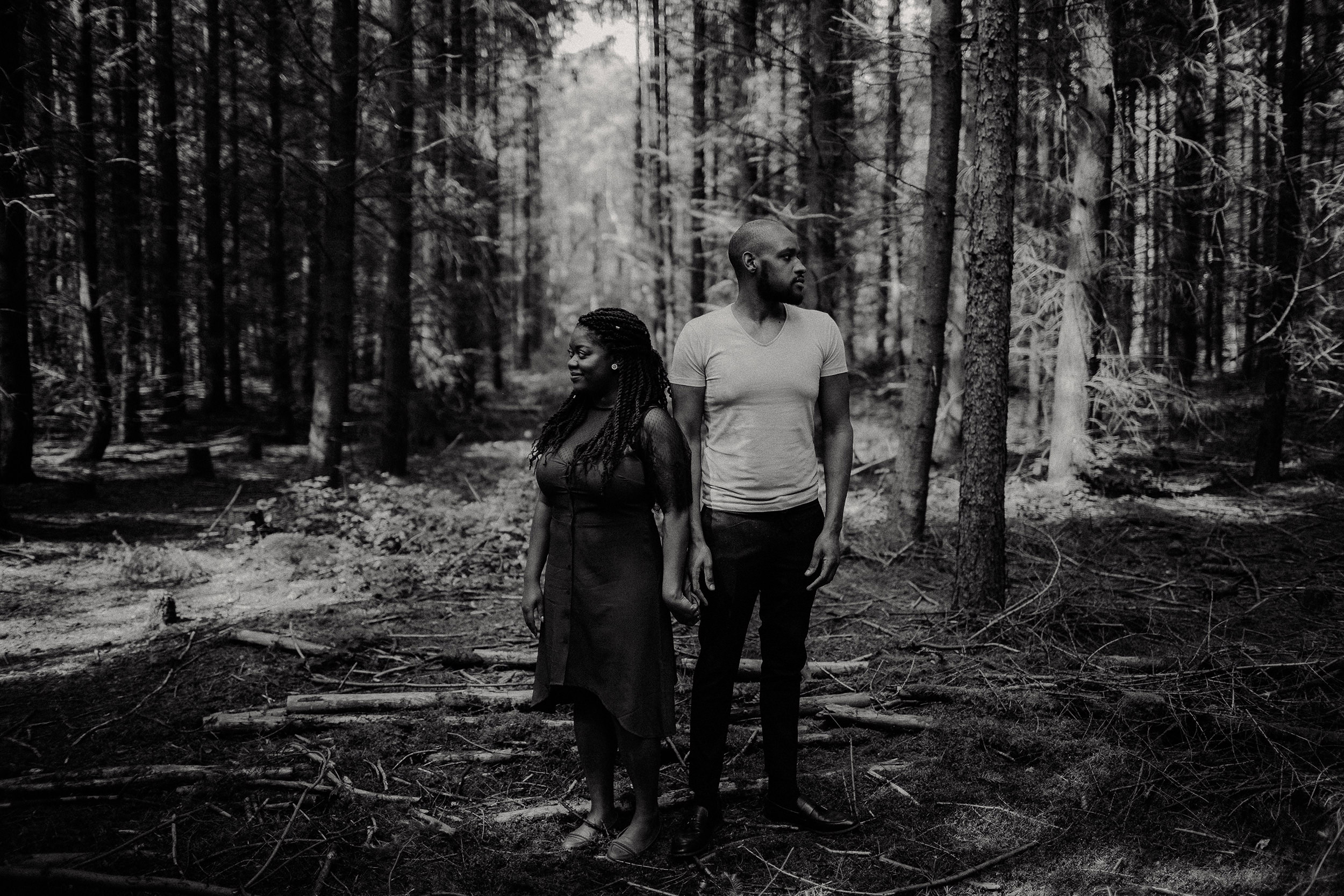 engaged couple holding hands in the Black Forest