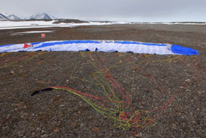 The sail is ready to be connected to the paraglider's seat and motor.