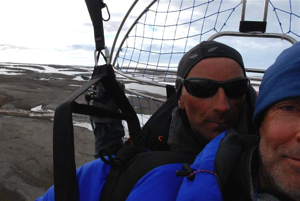 In flight: Ben (pilot - never without his REVO!) and Luc Hardy, back from Kaffeklubben towards our base camp at Bliss Bugt.