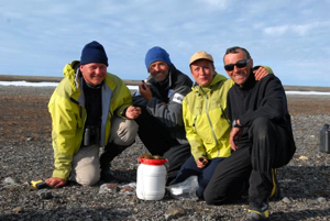 From left to right: Dr. Olivier Gilg, Luc Hardy, Brigitte Sabard and François 'Ben' Bernard around the Arctic poppy.