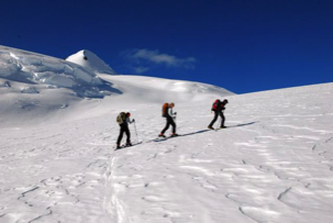 Skiing up the mountain towards summit.