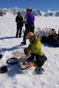 Brigitte quickly installs our kitchen as soon as the plane leaves, melting snow for many purposes.