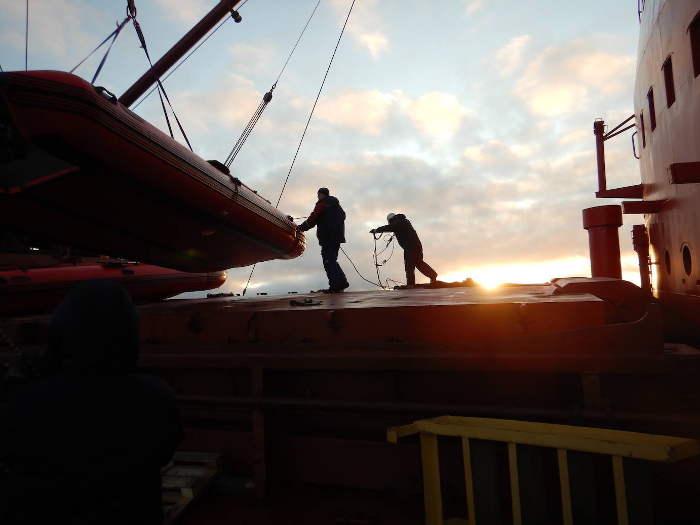 Unloading the rubber boats from our mother ship SOMOV , to execute a final open dive in the East Siberian Sea