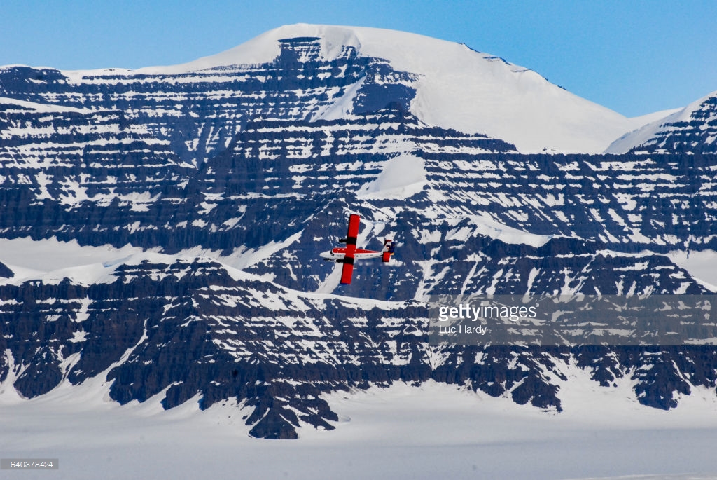 Red airplane landing in Greenland.jpg