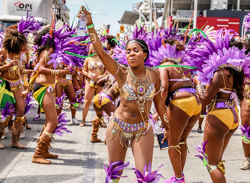 Woman-dancing-in-crowd-at-caribana-.jpeg