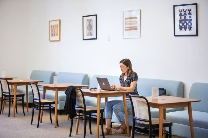 PMG PHOTO: JONATHAN HOUSE - Leah Lavelle works in an open cafe-like space at The Riveter.