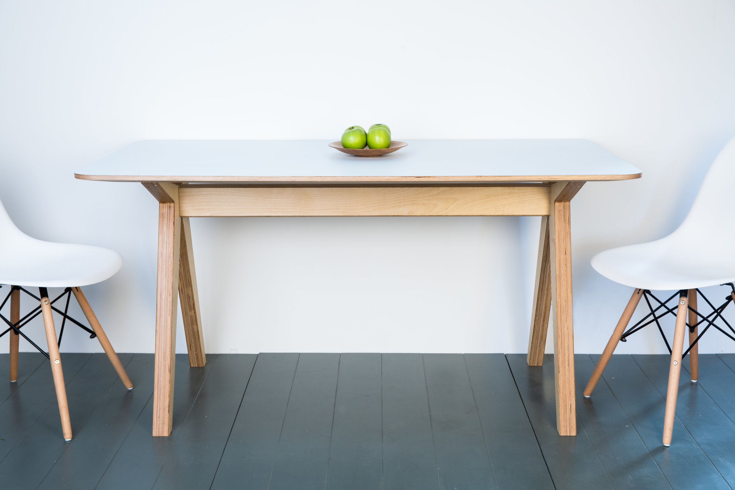 Kitchen trestle table in birch ply with a formica surface. This table is available in a colour of your choice and can be built to your exact size requirements. material: birch ply, formica dimensions as shown: l 1500 h 750 d 800 please contact for pricing
