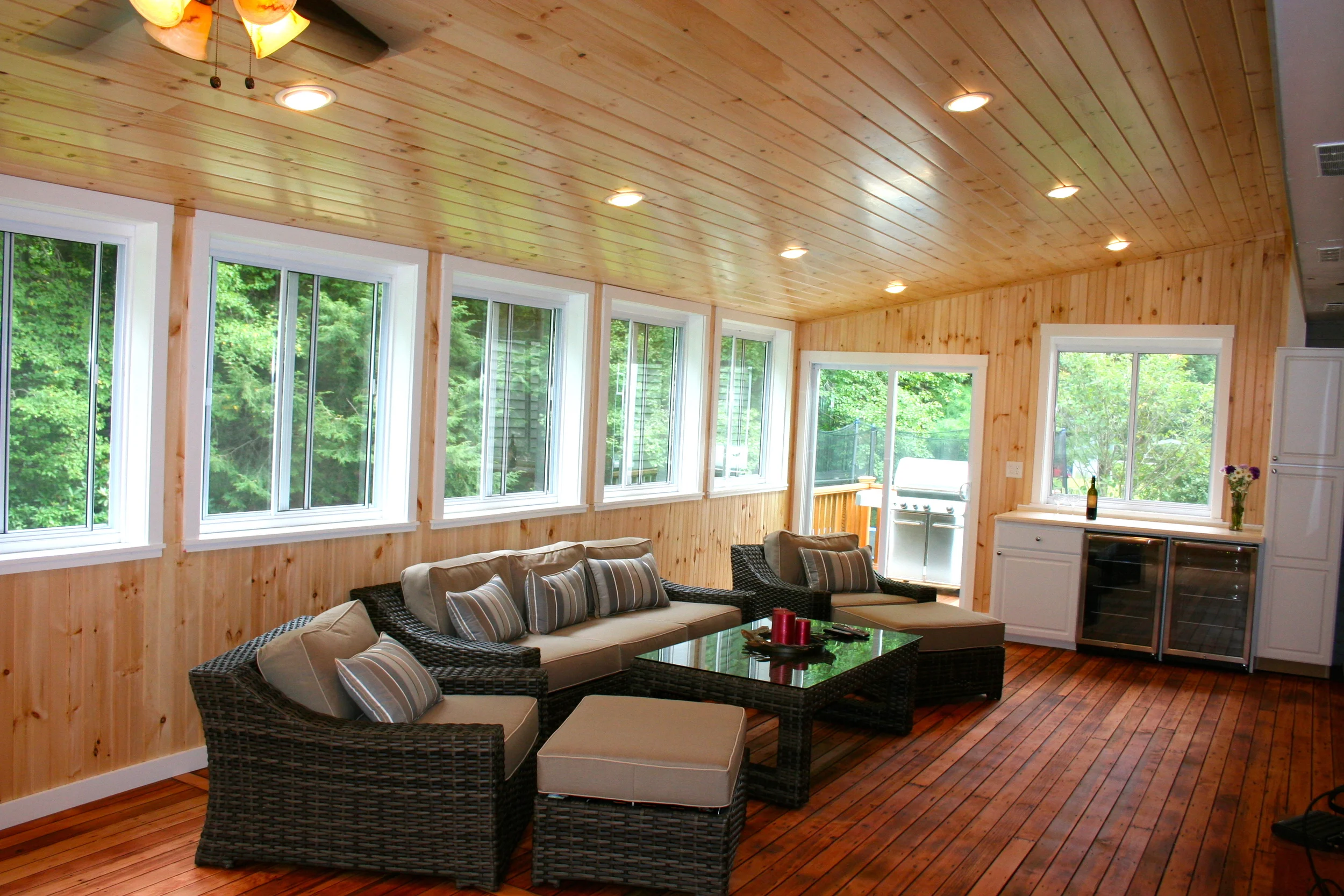 An old screen porch becomes a three-season room.