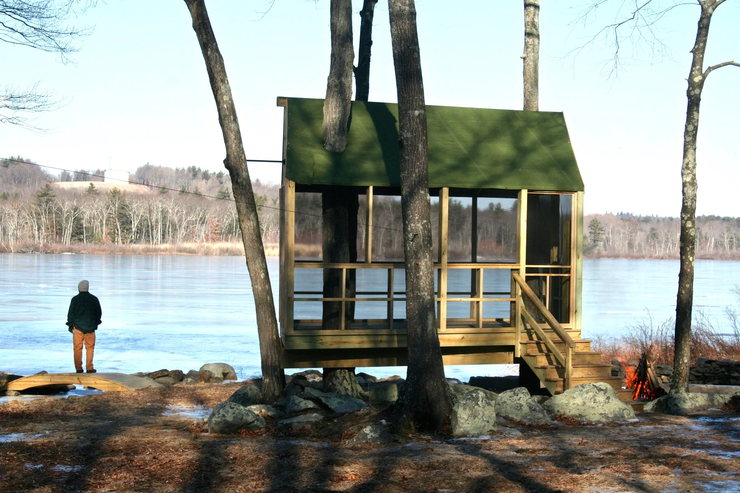 A roofed and screened-in treehouse is a fun and comfortable place to enjoy the pond!