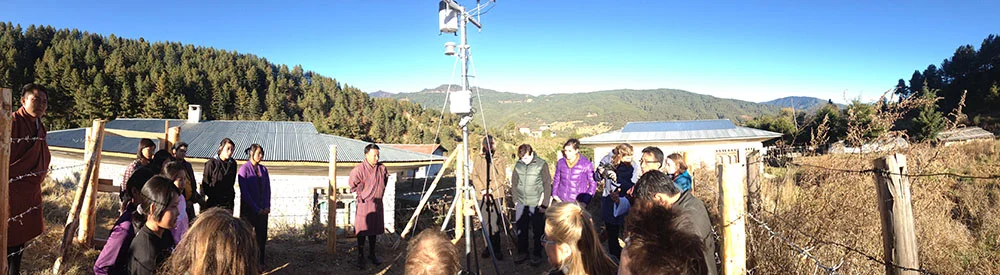 The weather station in Bumthang, Bhutan with Changa Tsering, HEROES project coordinator, and the local environmental club.