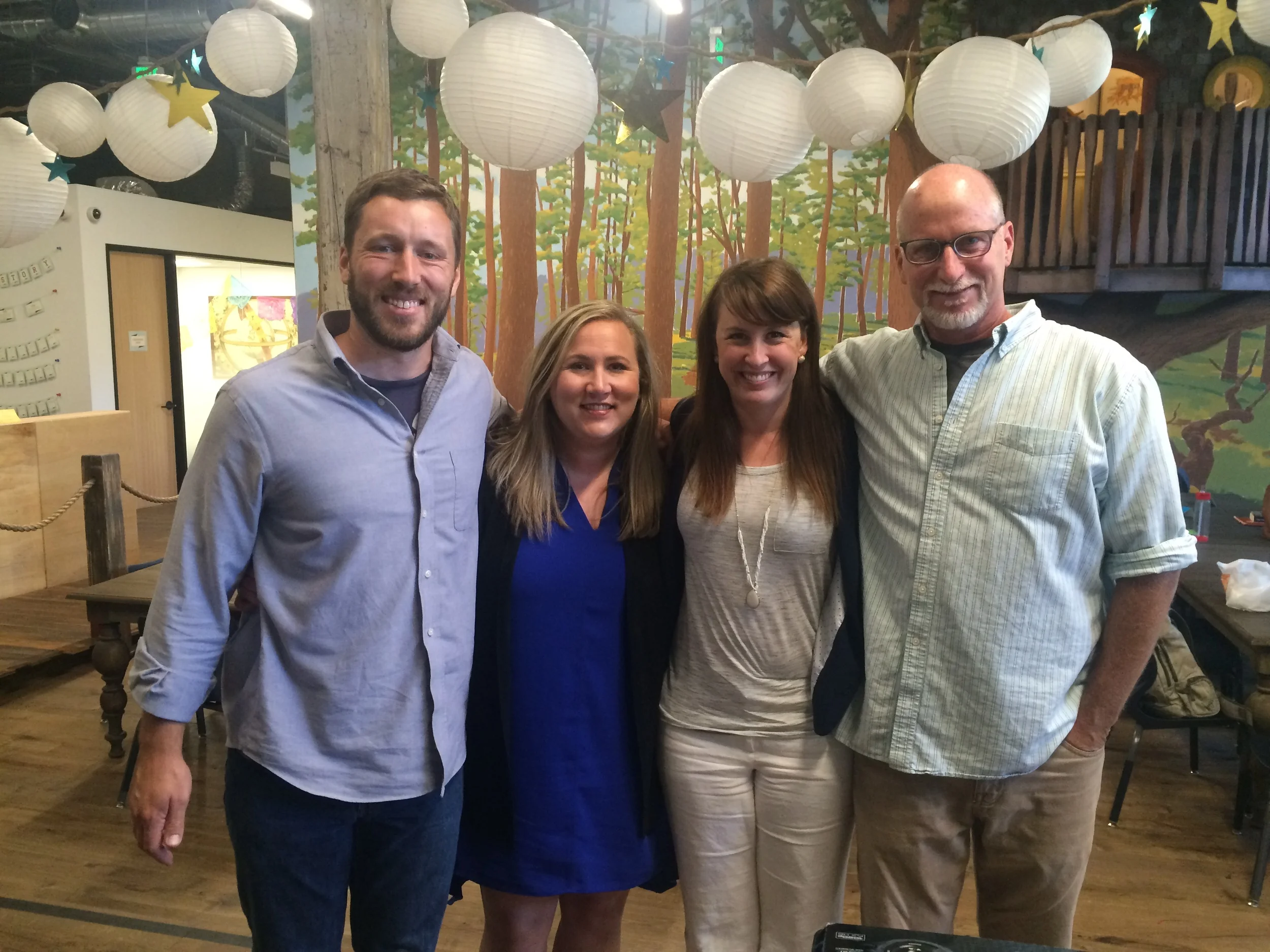 From the left, Mr. Wendelin, Claire Kiefer (Voice of Witness Education Program Associate), Mrs. Thyer, and Cliff Mayotte (Voice of Witness Education Program Director) pose for picture at the 826 Tenderloin Writing and Tutoring center after sharing Stagg VOW's work and gratitude to Voice of Witness for all their help in our journey. 