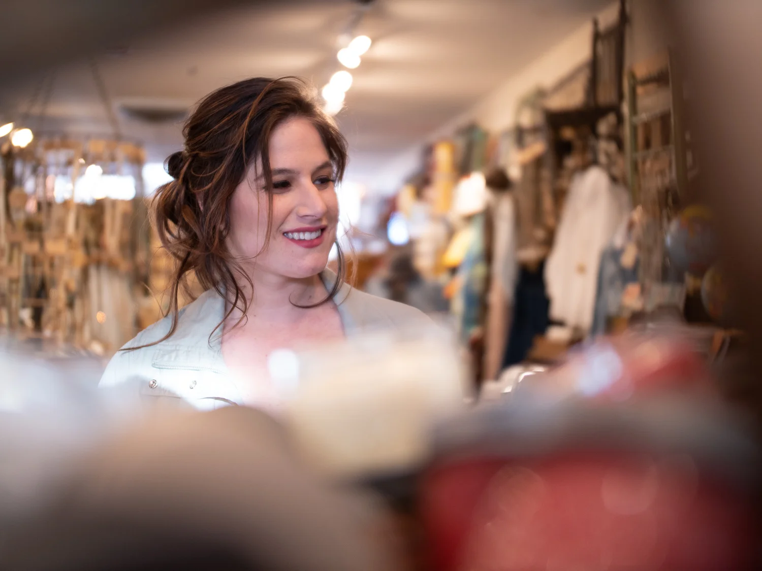 Kara: a loose and natural updo in a rich brown color, with warmer rose gold and peach accents