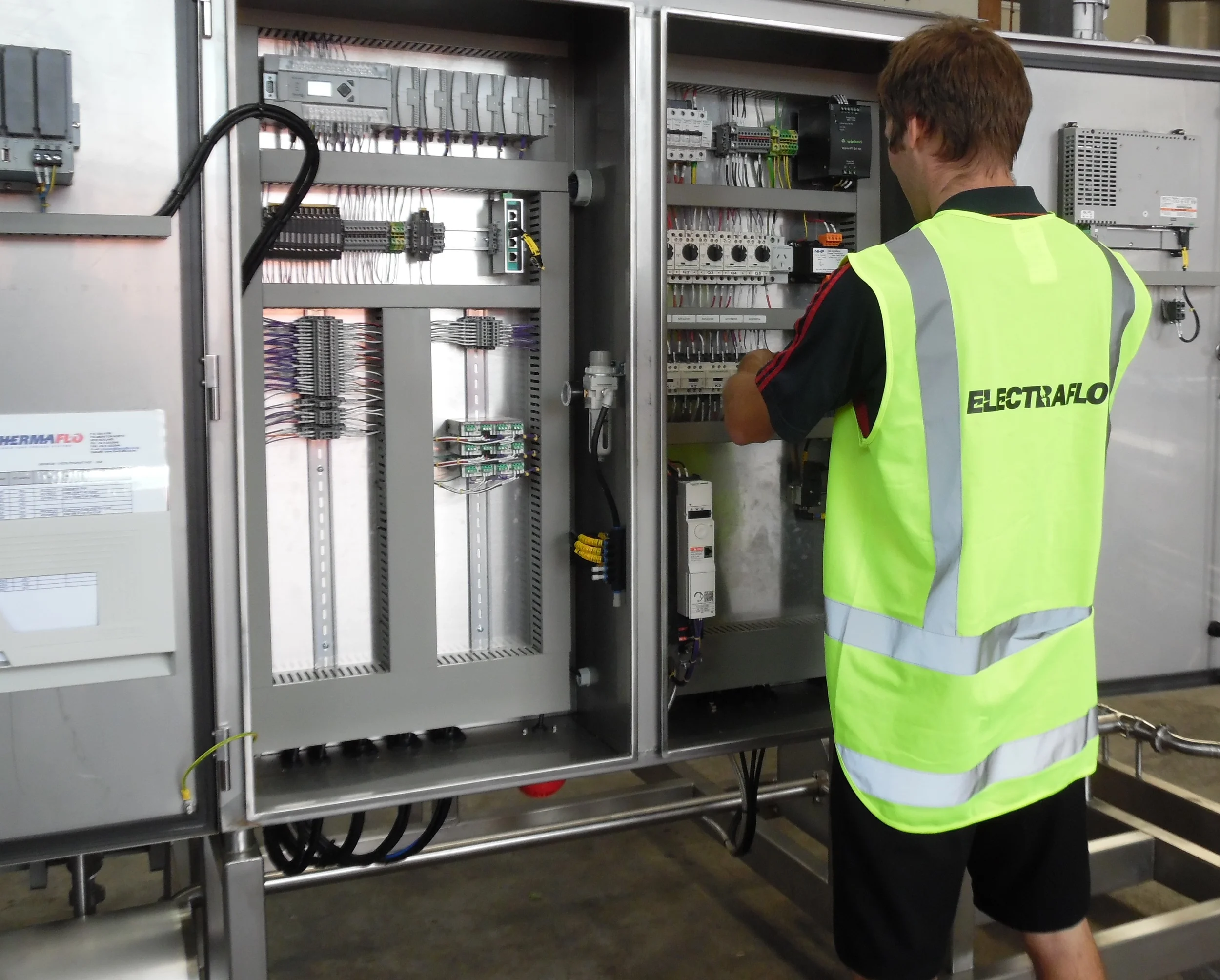 Zane working on control cabinet.jpg