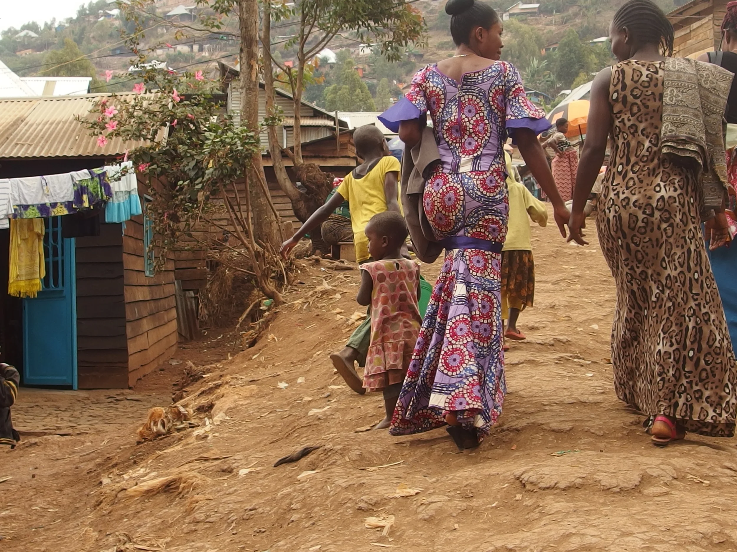 Walking with two of the sewing machine recipients to their workshop. They work together and have already started training three more women from their community on their machines.