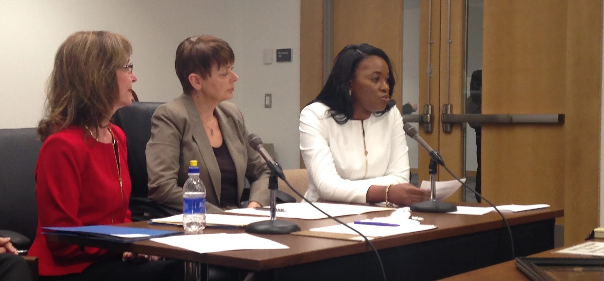 Dr. Edwige Mubonzi testifying with Dr. Ellen Kennedy (far left) and Senator Sandra Pappas (Middle)
