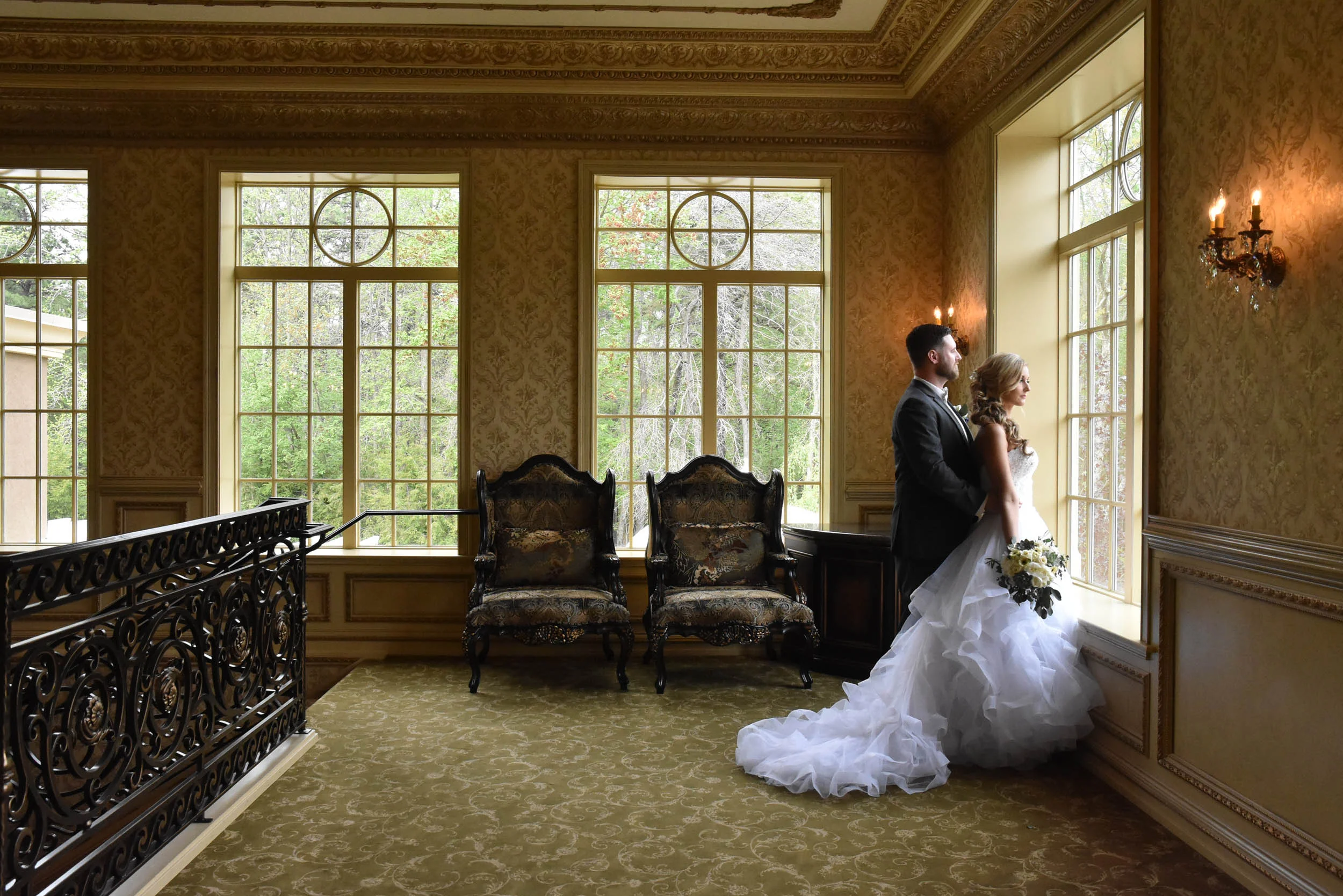Bride and groom dramatic window at Brigalias
