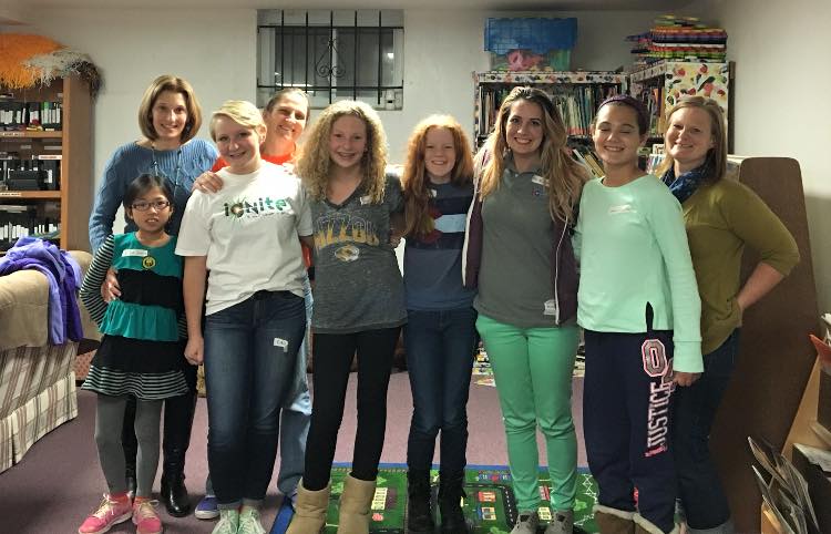 SPARKs Kira, Taylor, Angela, and Helen along with parents Mrs. Losse, Mrs. Averett, Ms. Schiller and Community Outreach Coordinator Kimberly Kavanagh plus Jr. SPARK Leya volunteering with Childcare to the residents of Our Lady's Inn Crisis Nursery and Maternity Homes in St. Louis City.