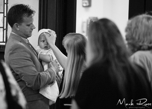 The beginning of the christening at the back of the church.