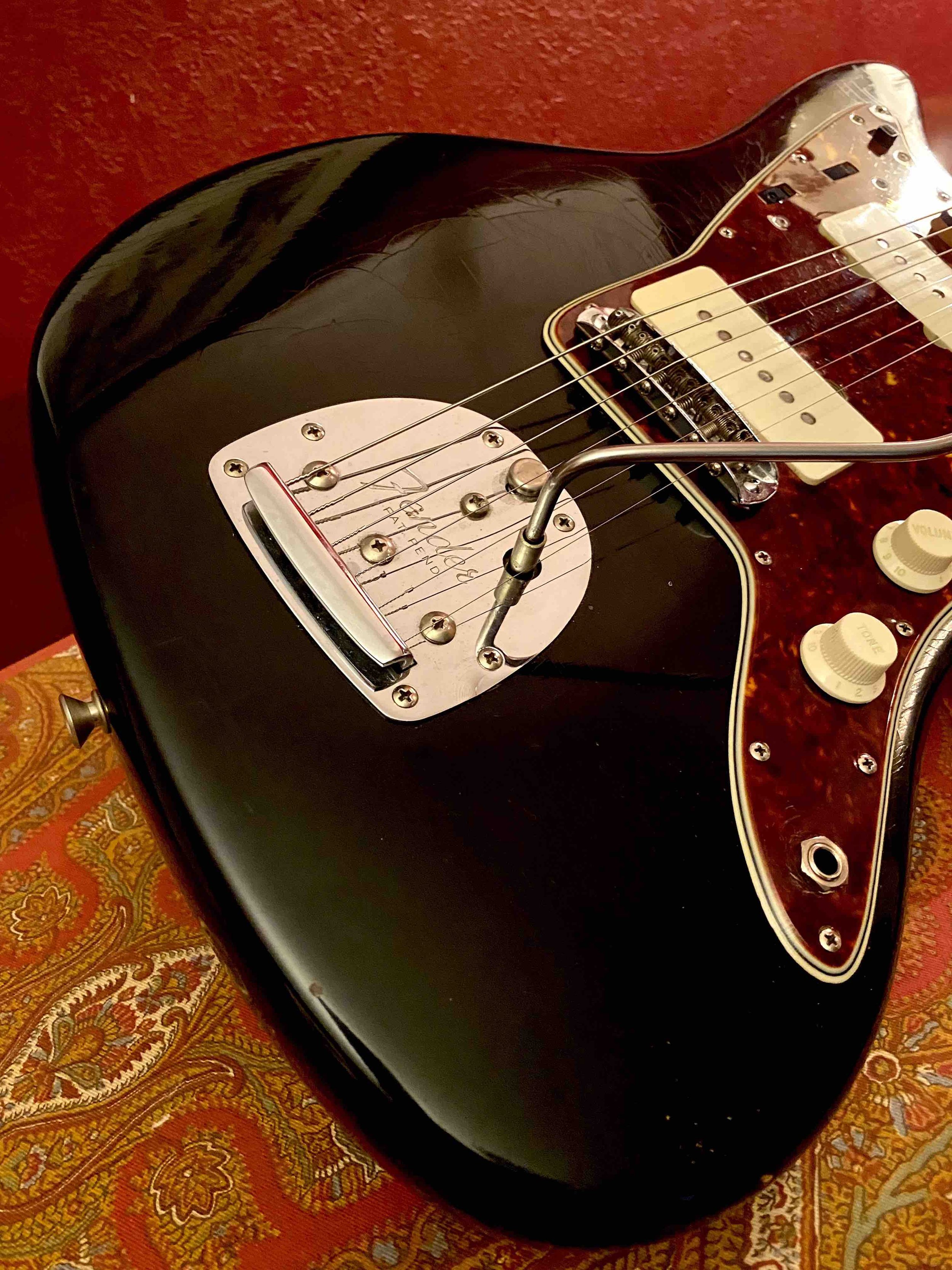 61 fender jazzmaster black top checking.jpg