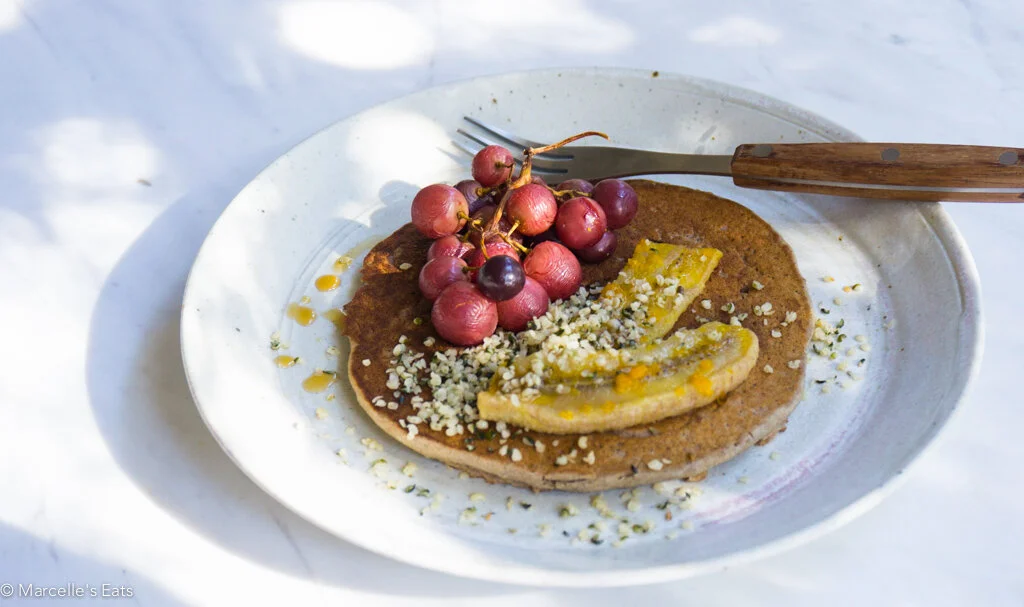 Banana Buckwheat Pancakes with Roasted Bananas, Grapes, Hempseed & Maple Syrup