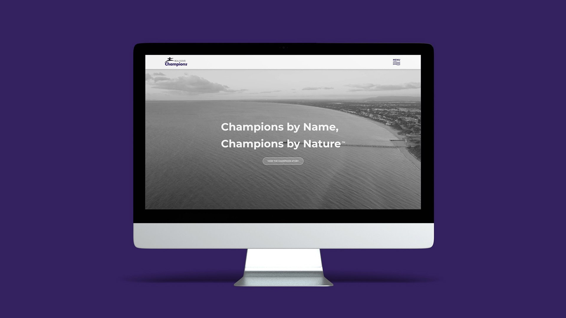 The homepage of Real Estate Champions' website on an iMac 