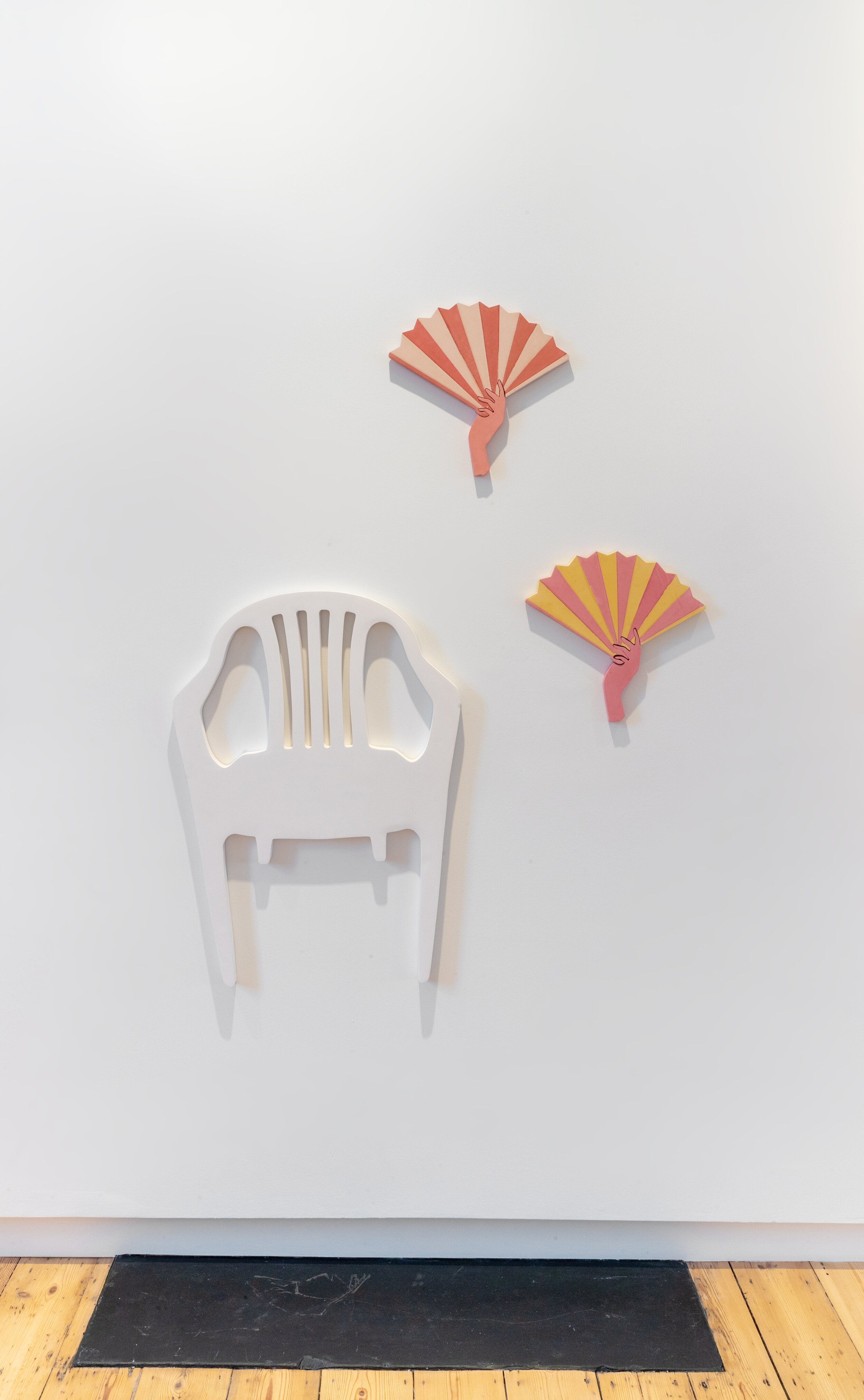  Irini Bachlitzanaki, Chair (white Monoblock), 2021; The Hand-Held Fan and the Calming Hand (light pink/pink and yellow), 2021. 