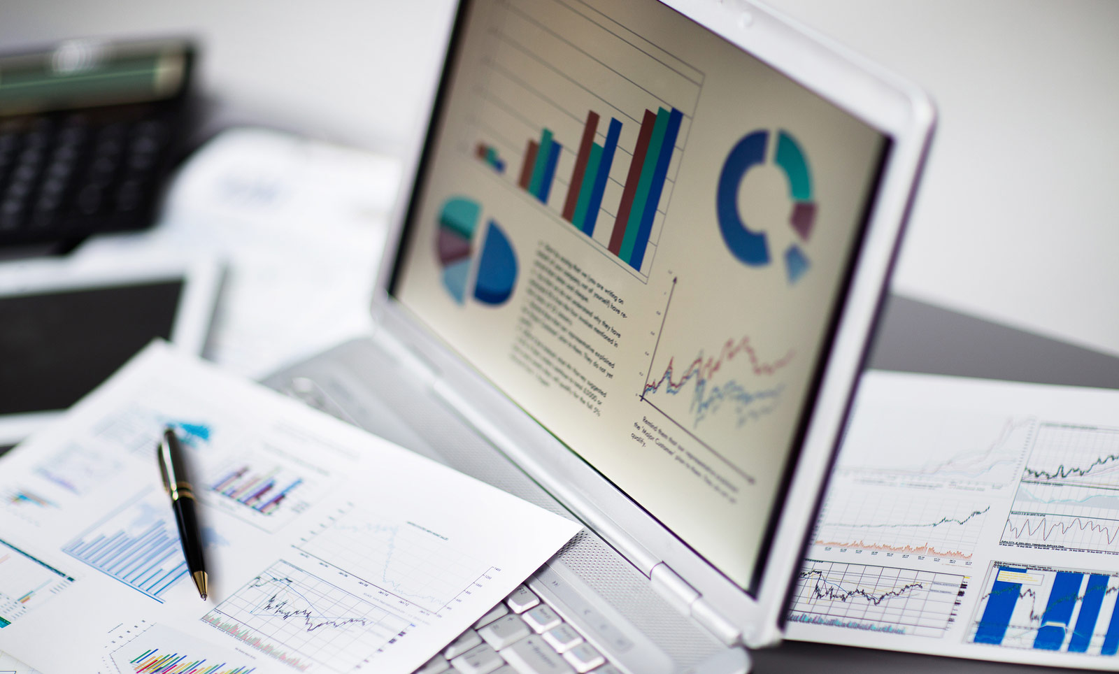 bigstock-analyzing-investment-charts-wi-82252127.jpg