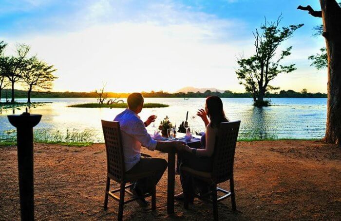Honeymoon-couple-dining-in-a-jungle-lodge.jpg