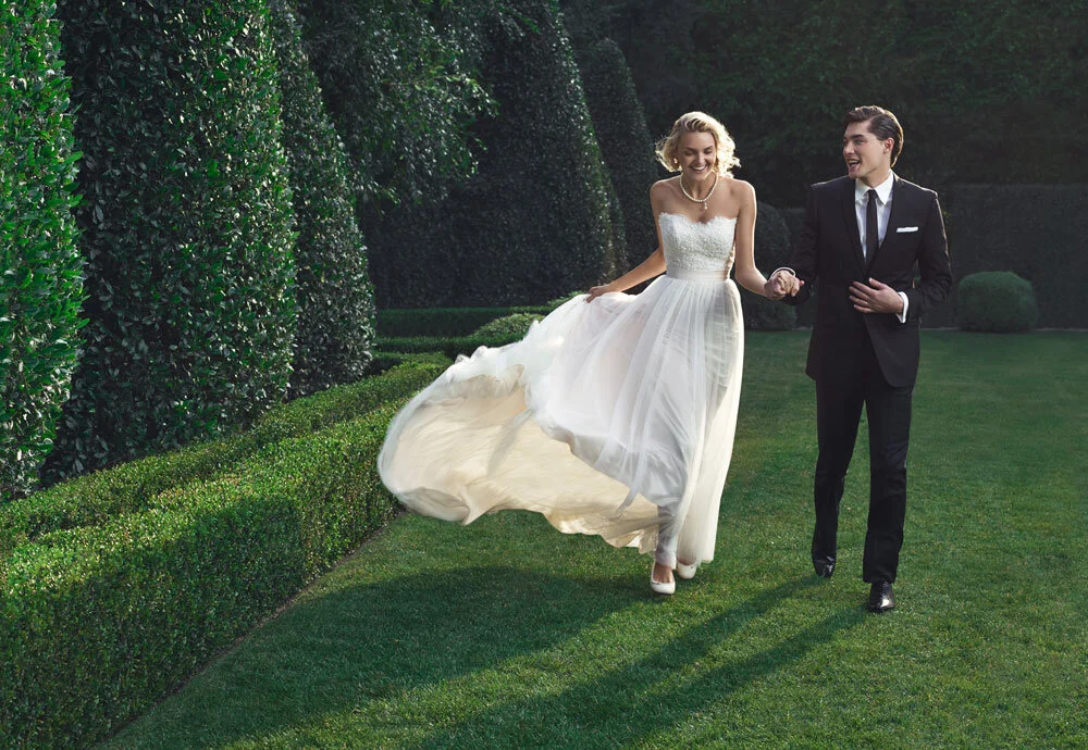 bride in wedding dress with groom in suit