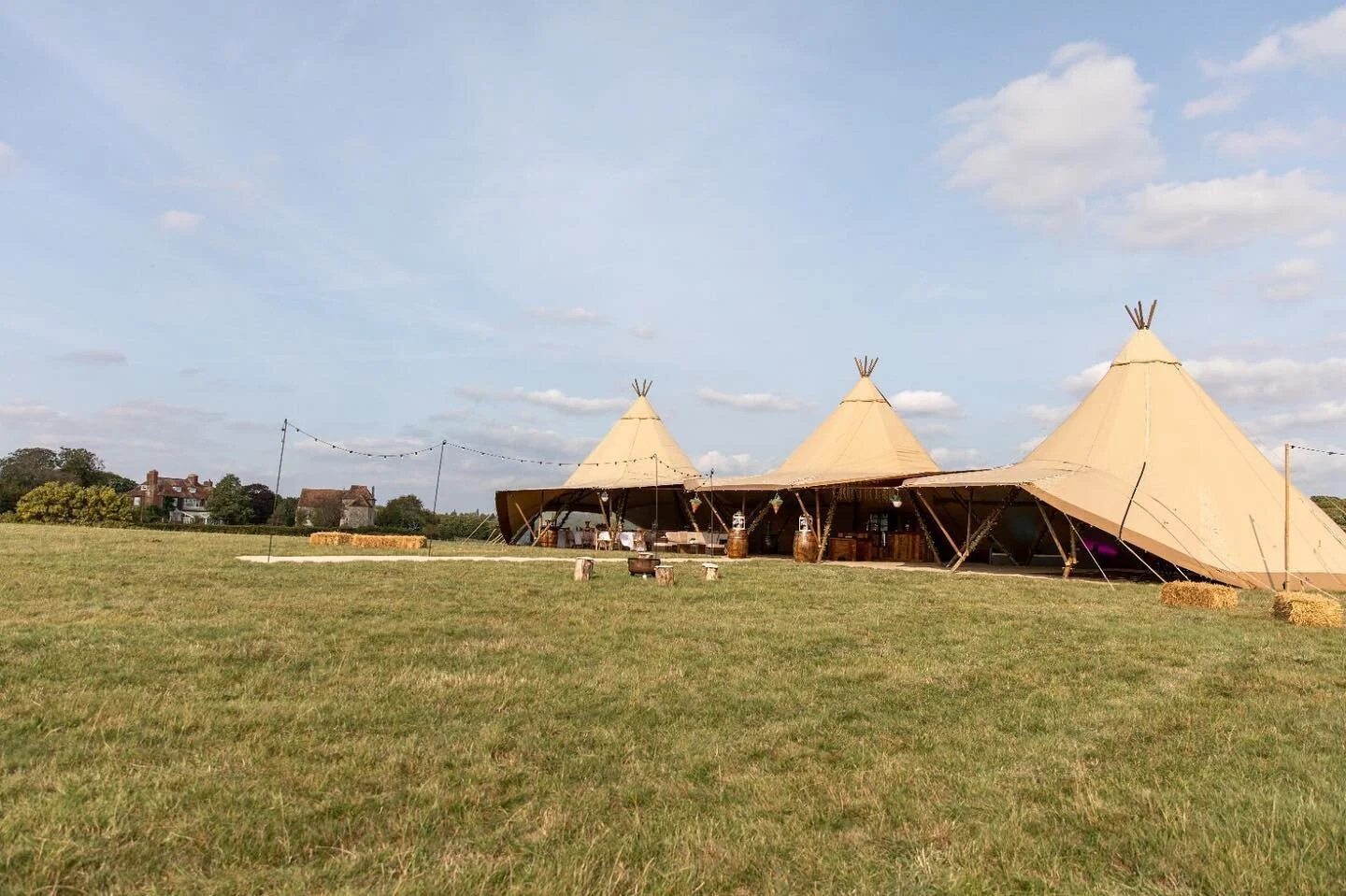 3 wedding tipi in a field on grass