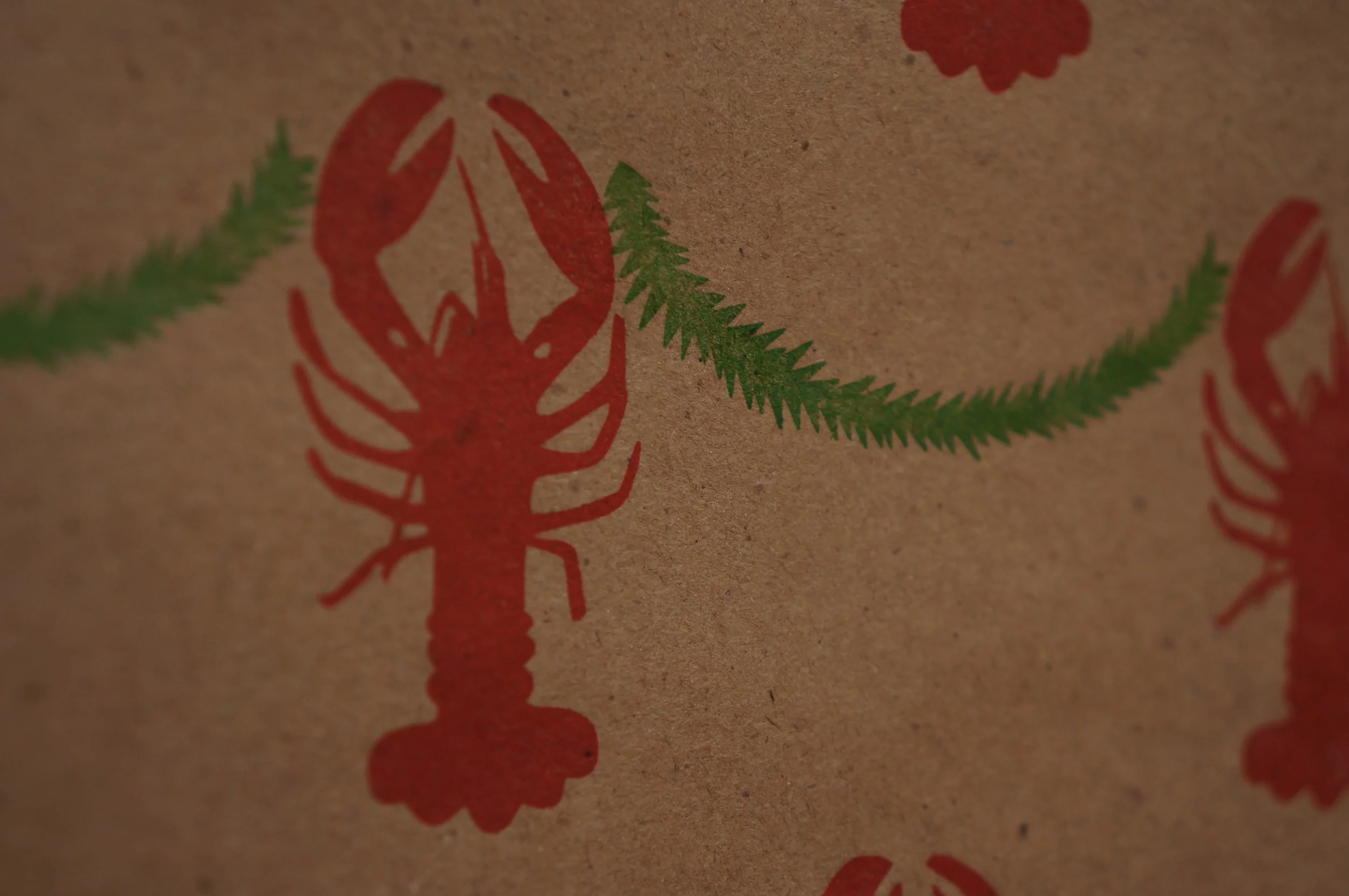 Paper Forward | Closeup: Lobster Garland print wrapping leterpressed on 100% recycled paper