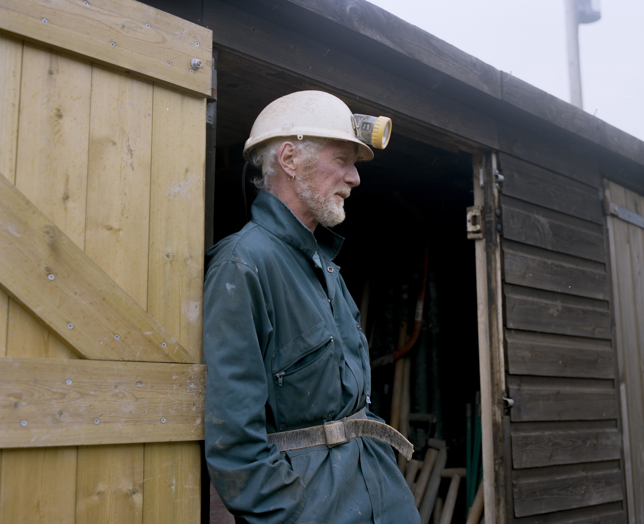 Adam opening the doors of the equipment shed.