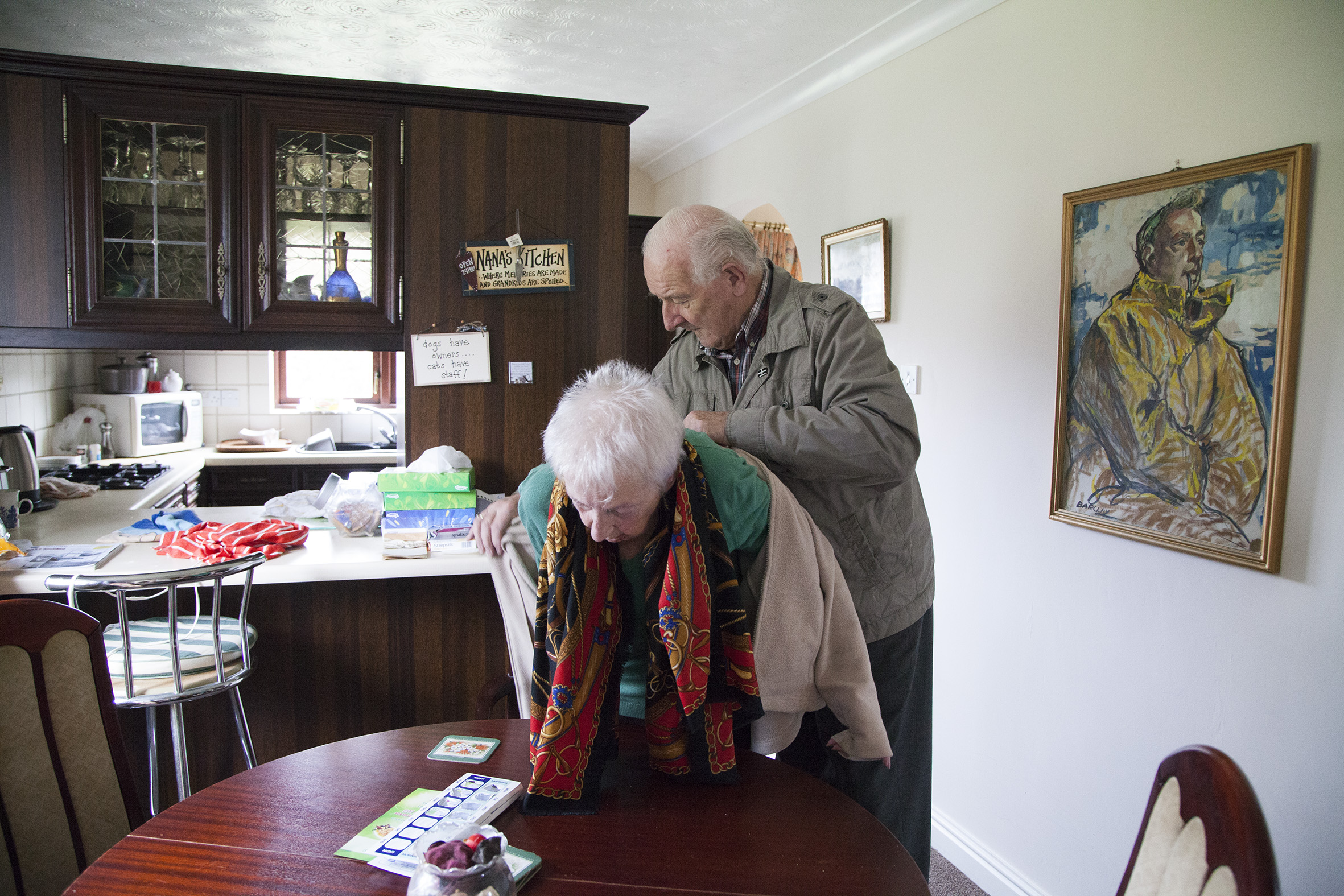 Graham helping Lilyan get dressed to go out.
