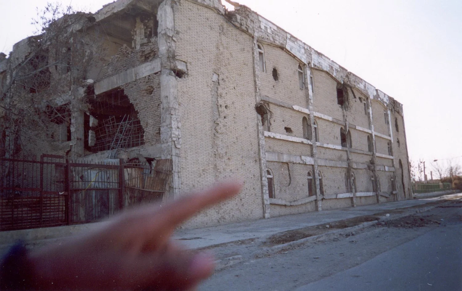 I do not remember taking this picture but I think the hand is pointing at the ruins we were going to take pictures of. This house before was beautiful. When Taliban came they would think that maybe there were soldiers hiding in the buildings so they would bomb them and turn the buildings into ruins and there was no soldiers there. I hope peace will last a long time now. Peace is the most important thing to the children of Afghanistan. (c) Khatol / Shooting Kabul / PhotoVoice