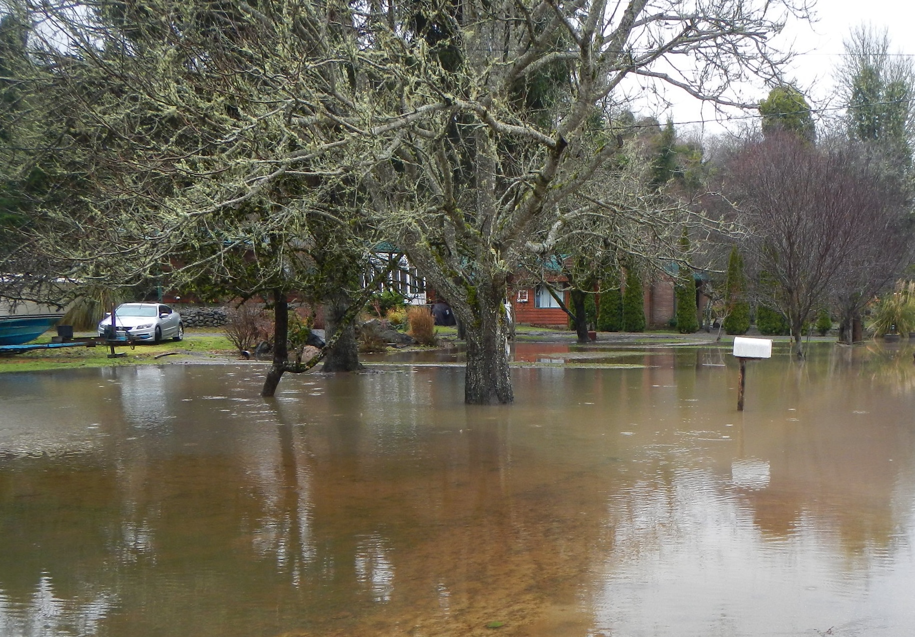  Floods damage roads and homes. (photo credit: Pat McCullough)    