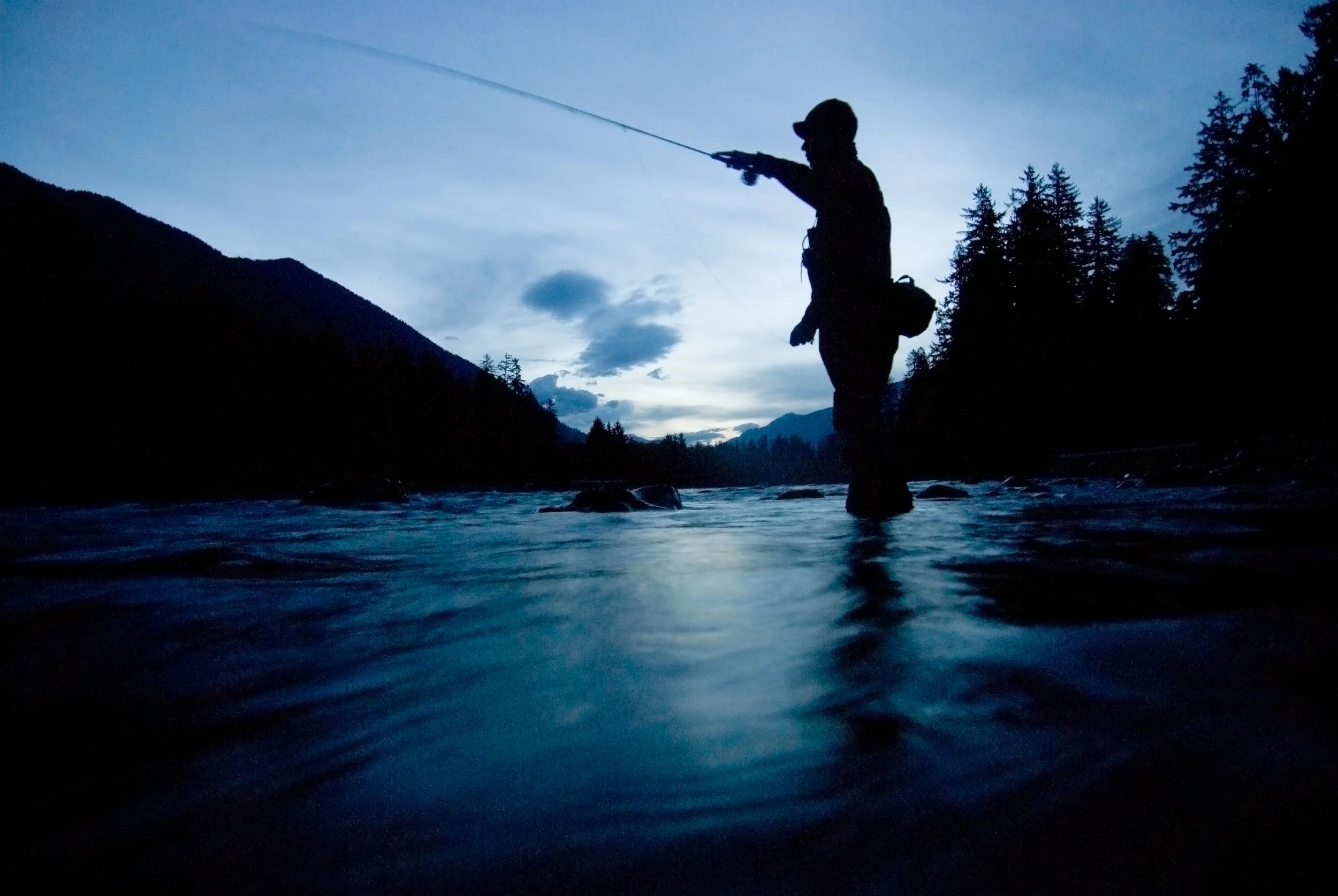 Fishing guide Shannon Carroll fishing at dawn for steelhead on the Hoh River. Photo by Bridget Besaw.