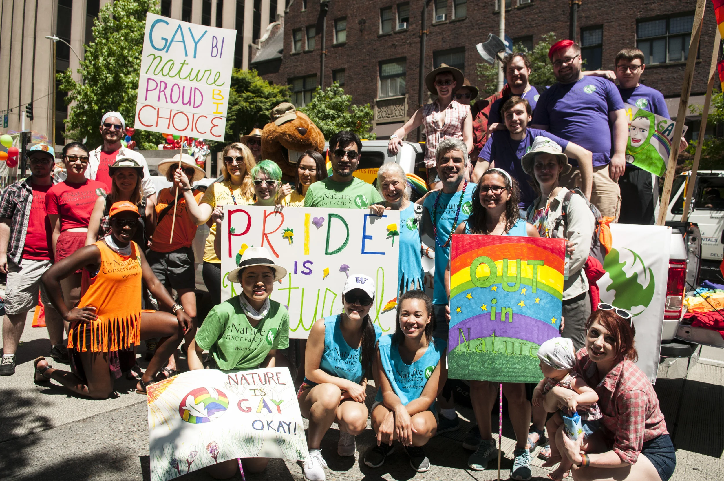 Nature Conservancy in Washington staff and volunteers pose before beginning the 2017 Seattle Pride parade. Photo © Nikolaj Lasbo / TNC