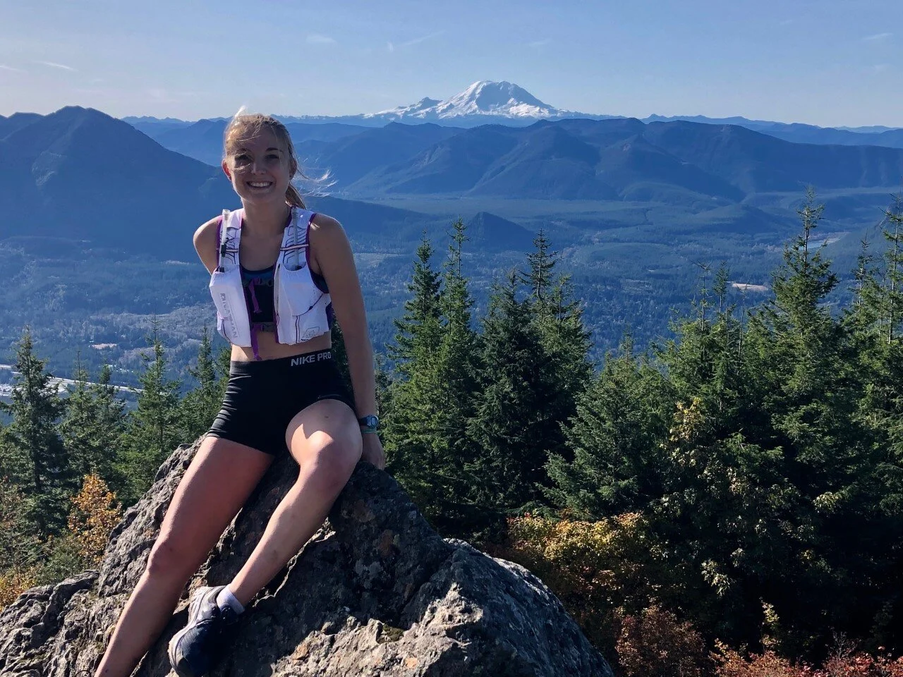 The author reaps the benefits of trail run to the top of Mt. Si. This brief rest came during an 18-mile run! Photo courtesy of Kristina Randrup.